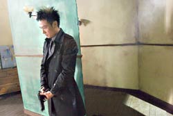 Francis Ng pauses to reload.