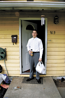 Dressed to the nines, as always, Nick Sears faces the world from his family’s front stoop.