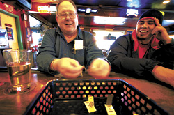 A patron takes a lucky pull at the smoke-free Tug Tavern.