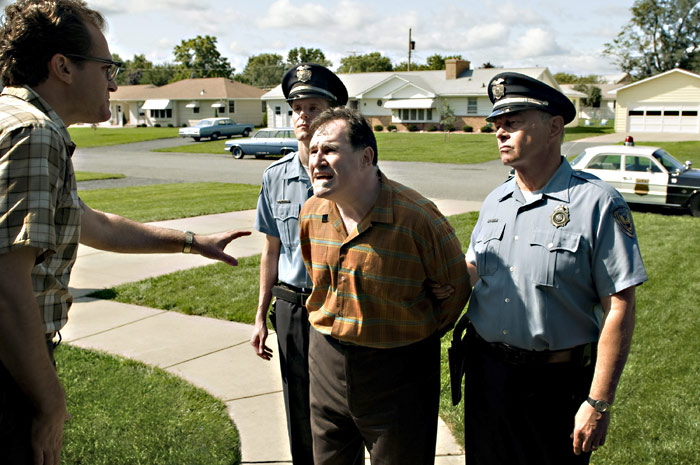 Men in uniform come to take a Jew (Kind, at center) away. Sound familiar?