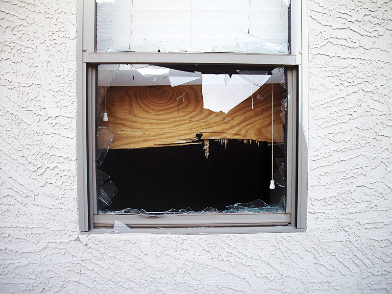 Kidnappers nailed sheets of plywood over the windows of this west Phoenix home to keep hostagesfrom escaping.