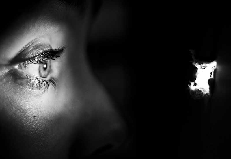 Perkins peers at Leigh in Psycho.