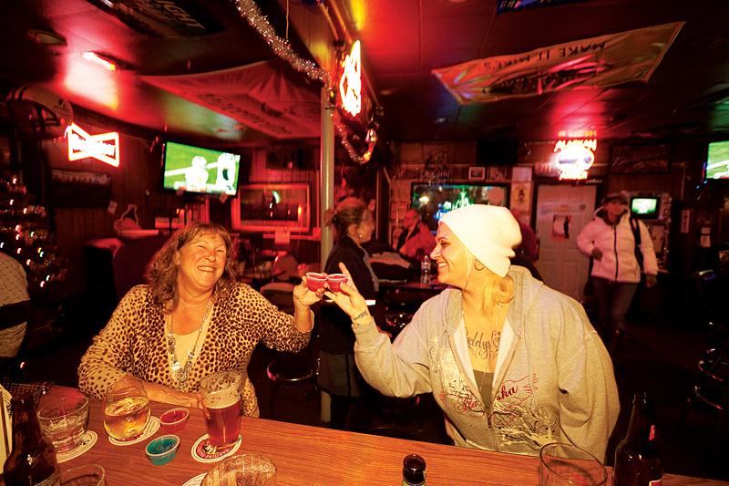 At a dollar a shot, Tug patrons Dora (left) and Elizabeth Young can buy round after round—for the entire house.