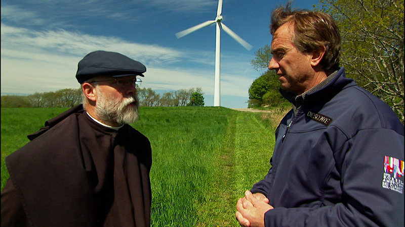 Local activist John Bryon talks wind power with Kennedy.