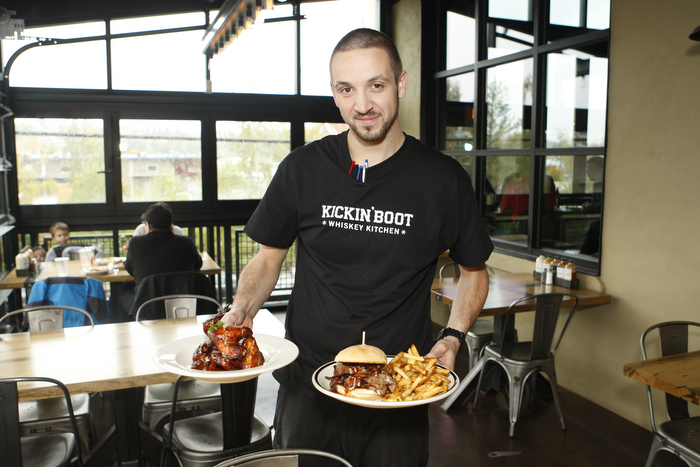 SEATTLE WA SUNDAY OCT 15, 2012 Kickin' Boot in Ballard offers an assortment of barbecue inspired dishes in the dark restaurant with large TVs and a pyramid of various bottled liquors. Photo by Kevin P. Casey/Seattle Weekly