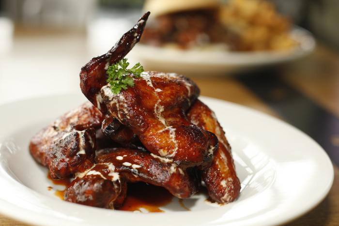 SEATTLE WA SUNDAY OCT 15, 2012 Kickin' Boot in Ballard offers an assortment of barbecue inspired dishes in the dark restaurant with large TVs and a pyramid of various bottled liquors. Photo by Kevin P. Casey/Seattle Weekly