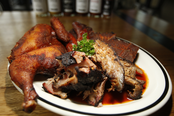 SEATTLE WA SUNDAY OCT 15, 2012 Kickin' Boot in Ballard offers an assortment of barbecue inspired dishes in the dark restaurant with large TVs and a pyramid of various bottled liquors. Photo by Kevin P. Casey/Seattle Weekly