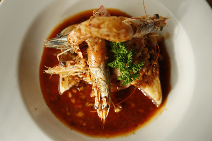 SEATTLE WA SUNDAY OCT 15, 2012 Kickin' Boot in Ballard offers an assortment of barbecue inspired dishes in the dark restaurant with large TVs and a pyramid of various bottled liquors. Photo by Kevin P. Casey/Seattle Weekly