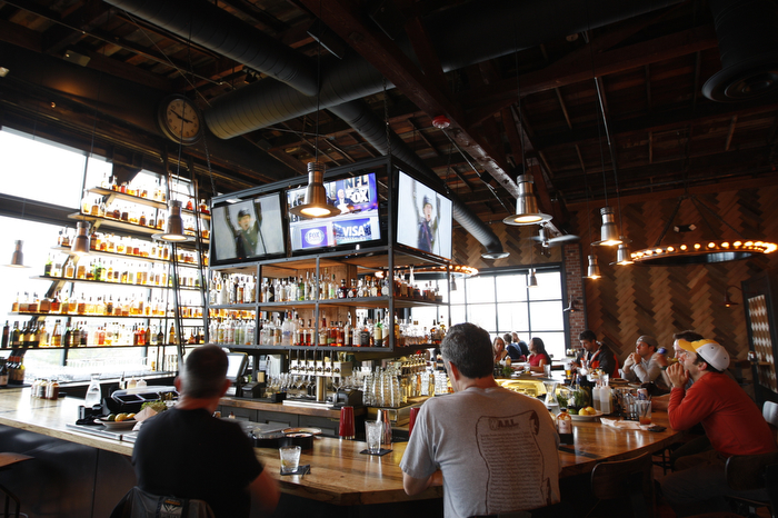 SEATTLE WA SUNDAY OCT 15, 2012 Kickin' Boot in Ballard offers an assortment of barbecue inspired dishes in the dark restaurant with large TVs and a pyramid of various bottled liquors. Photo by Kevin P. Casey/Seattle Weekly