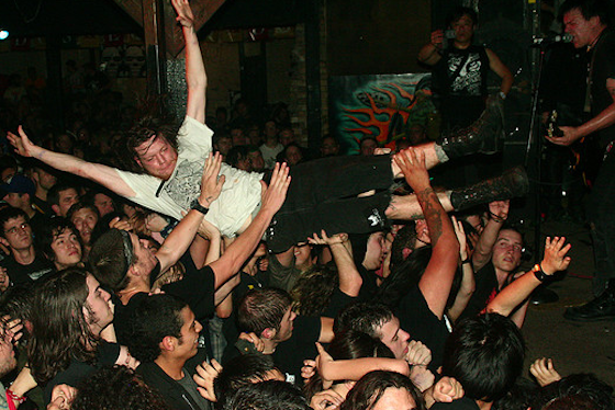 Chaos in Tejas is a celebration of a variety of music — from crust to punk, indie to hardcore — from May 31-June 3, 2012. This year's showcase in Austin, Texas will feature Ted Leo & The Pharmacists, the Clean and Death Evocation.In the photo above, a man crowd surfs while Tragedy plays Chaos in Tejas in 2008.