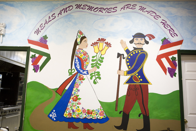 A hand painted wall adds to the comfortable atmosphere.