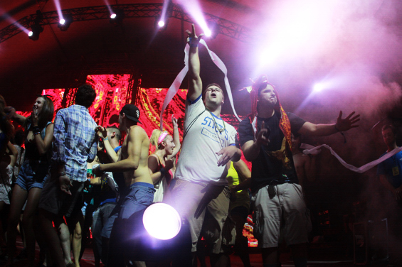 Girl Talk's fans walk it out on stage.