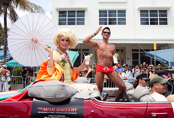 Drag queen Elaine Lancaster rides along Ocean Drive in South Beach as part of the Miami Beach Gay Pride Parade.