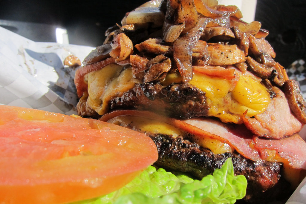 Source: Los AngelesWhere: The Cardiac Burger, The BucketThe Bucket in Los Angeles is probably most (in)famous for its Cardiac Burger. A heap of greasy onions and mushrooms piled atop bacon, grilled ham and two massive 1/2-pound beef patties.Read more on the LA Weekly: 30 Days of Burgers