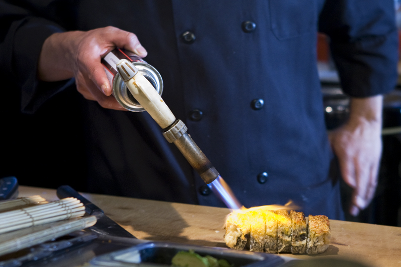 Chef Jose, torching the outside of the super bad boy roll.