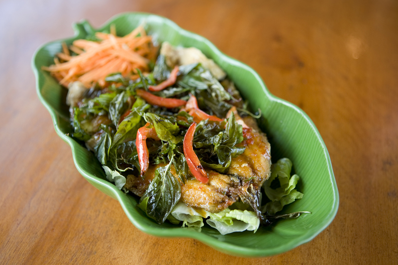 Smiling Sky:Deep-fried trout topped with house special Thai sauce and crispy basil leaves.