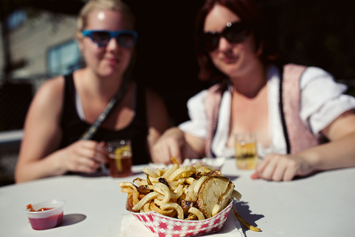 Amy and Christine contemplate their cube of french fries.