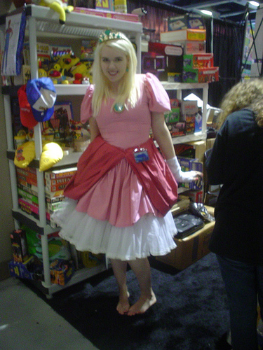 3. Ah, thereaE™s the Princess Peach we know and love. Sure, sheaE™s trying to sell you video merchandise with her pretty smile, but sheaE™s got a tiara!