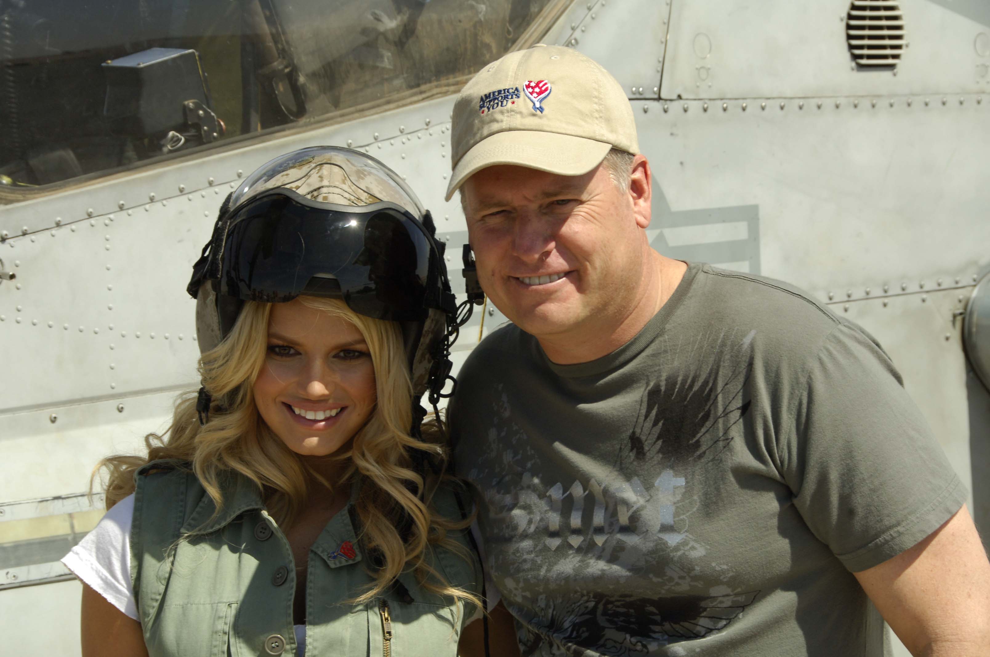 International superstar Jessica Simpson and her father, Joe, pose for a snapshot on the flight line at Camp Buehring, Kuwait on March 10, 2008. Ms. Simpson toured the camp and visited with troops during the day beforel performing at the Operation:Myspace concert in the evening. (U.S. Army photo by Pfc. David J. Marshall) (Released by Maj. Elton Roberts, USAR CENT PAO)