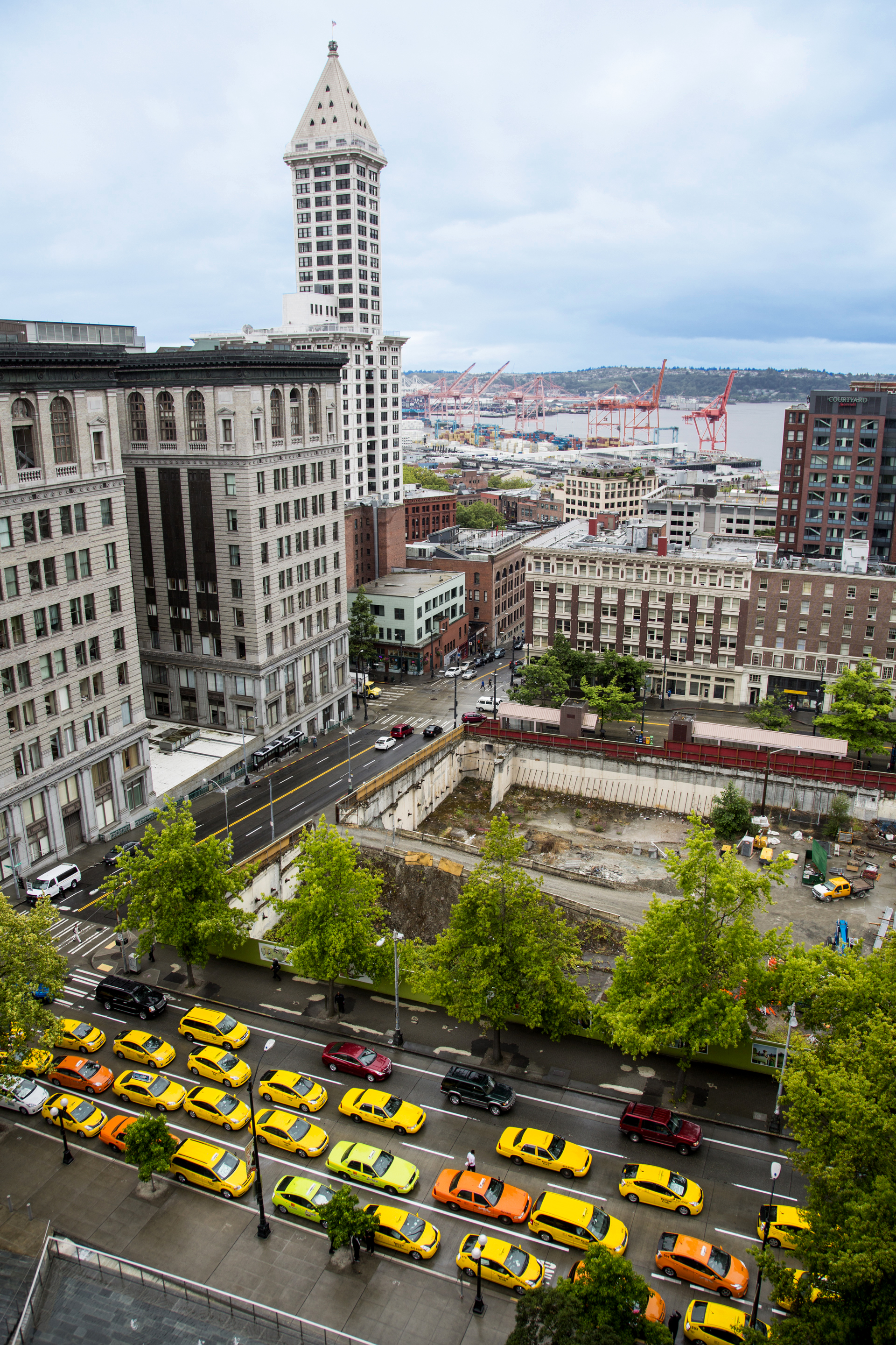Taxis line the streets in front of City Hall in protest.