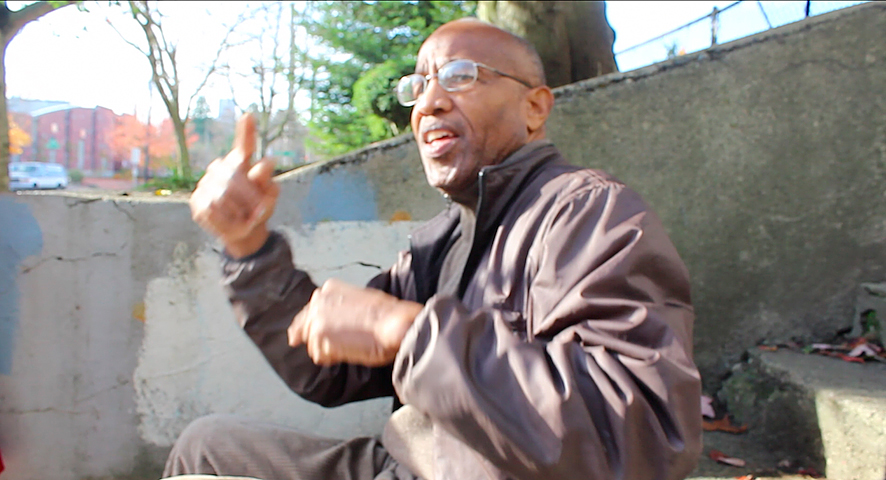Banners and African flags line the fences around the school.