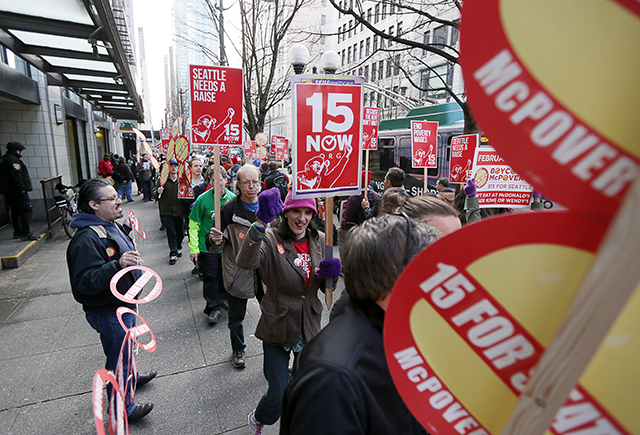 Dozens picketed outside of the McDonald’s on Third Avenue and Pine Street