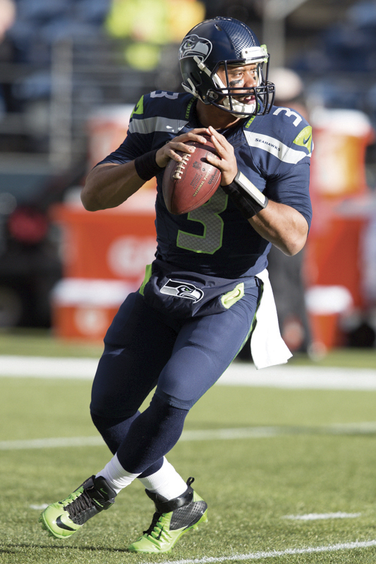 Seattle quarterback Russell Wilson warms up before the game.