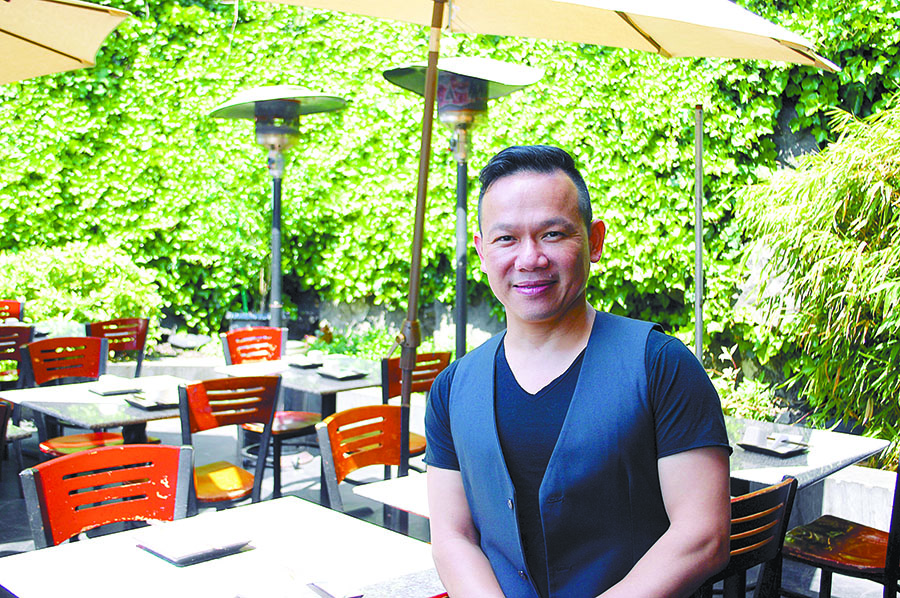 Tam Nguyen sits at his Tamarind Tree restaurant last week.