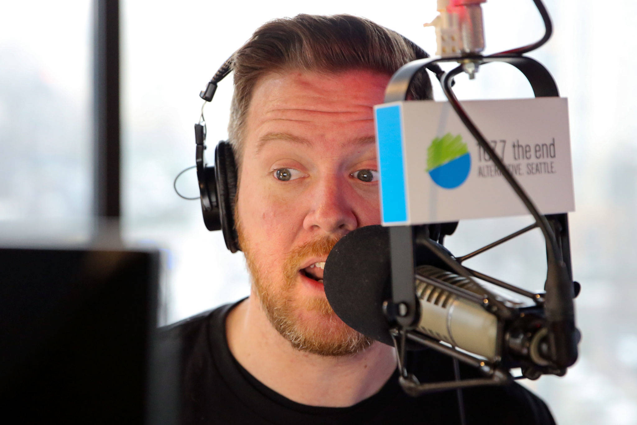 Gregr is on the air for 107.7 The End every weekday, from 6 to 10 a.m. It means an early wakeup and commute for him from his Snohomish home. (Kevin Clark / The Herald)