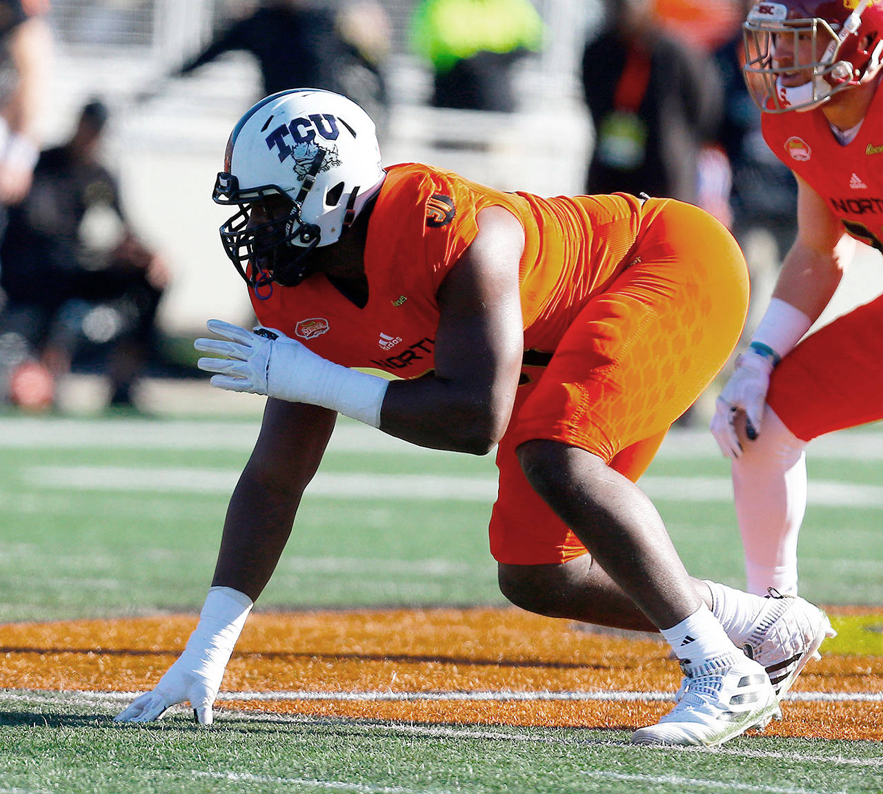 TCU’s L.J. Collier lines up during the Senior Bowl on Jan. 26 in Mobile, Alabama. The Seahawks selected Collier with the 29th pick in the first round of the NFL draft Thursday. (AP Photo/Butch Dill)