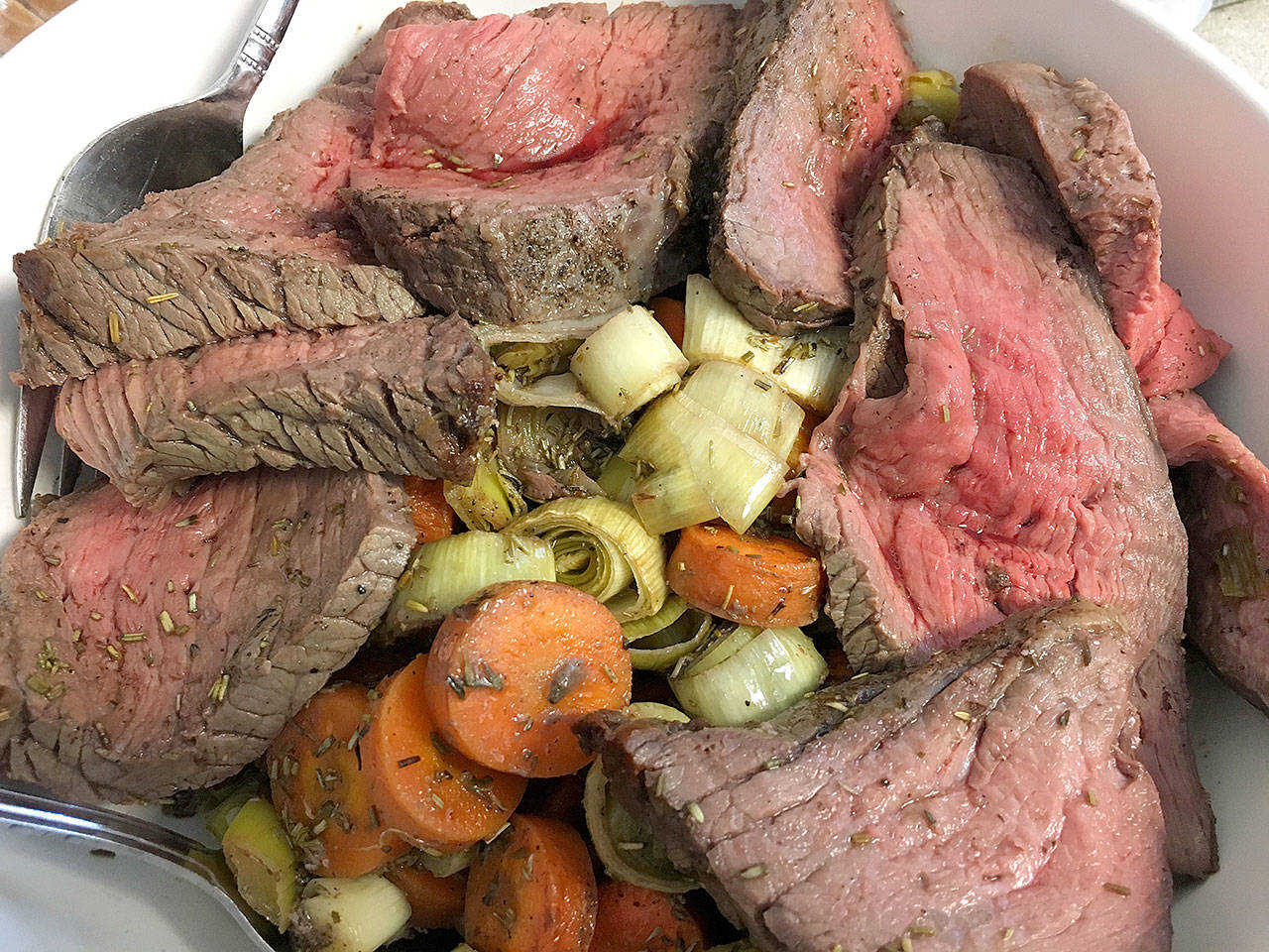 The roast aurochs with carrots and leeks, ready to be served, is a hearty dish from the cookbook, “A Feast of Ice & Fire: The Official Companion Cookbook” to the HBO show “Game of Thrones.” (Ben Watanabe / The Herald)