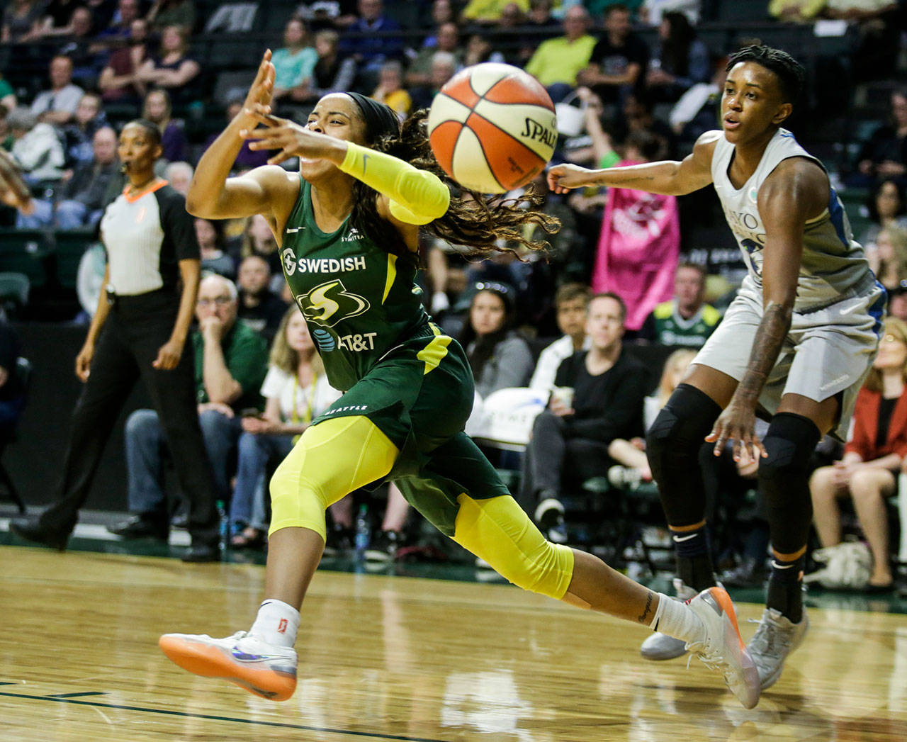 The Storm’s Jordin Canada loses the ball as she drives to the net during a game against the Lynx on June 4 at the Angel of the Winds Arena in Everett. (Andy Bronson / The Herald)