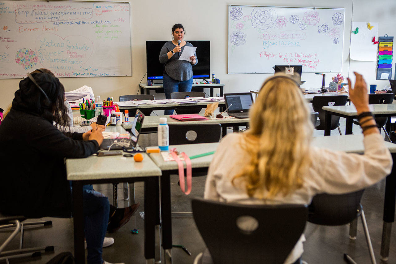 Sara Sandoval makes a presentation in Spanish while students listen to the interpretation in English through headphones during the Fundamentals of Translation and Interpretation class at Sno-Isle Technical Skills Center on June 6 in Everett. (Olivia Vanni / The Herald)