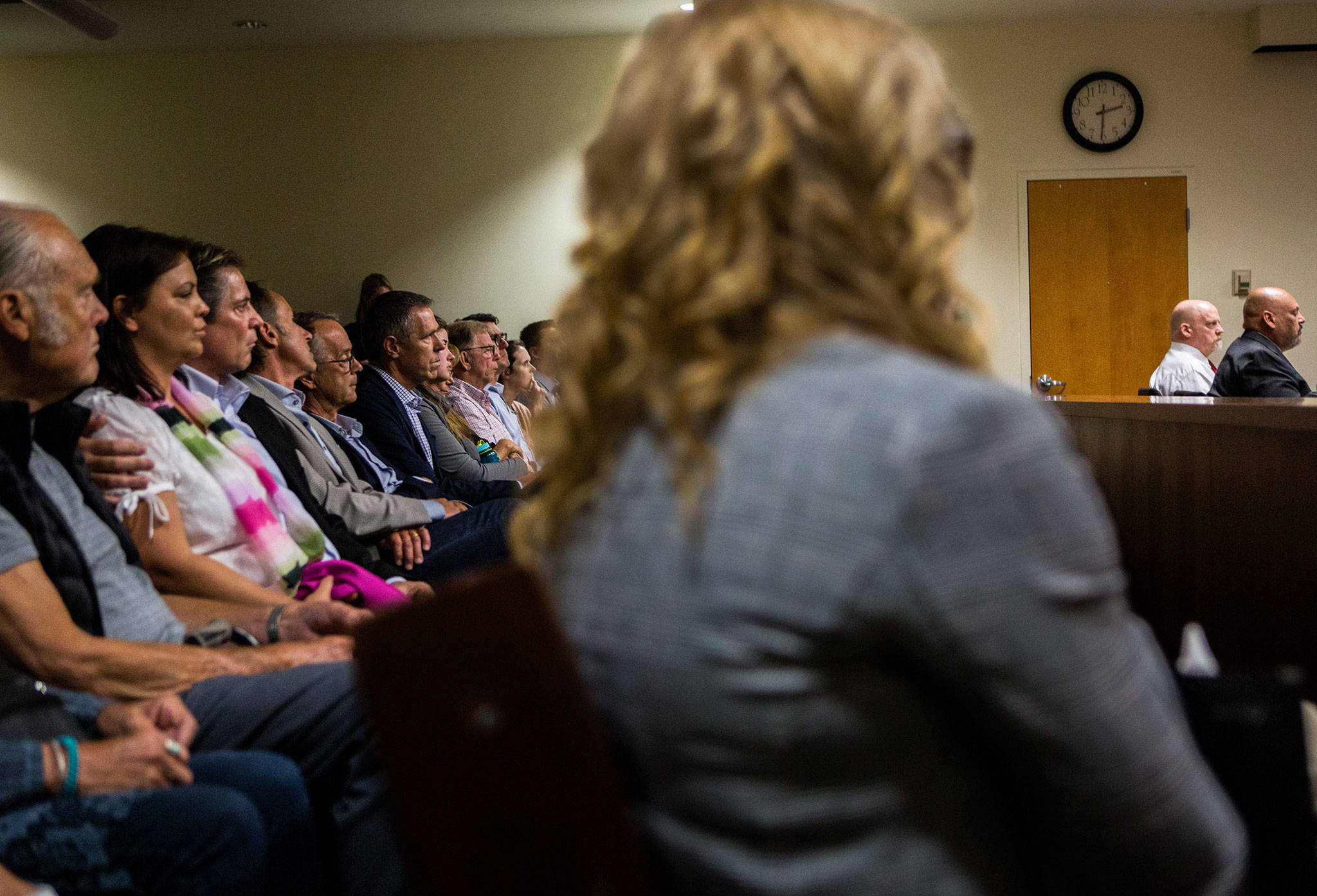 Members of Jay Cook’s and Tanya Van Cuylenborg’s families sit together in the second row of the gallery and look at the defendant William Talbott II during closing arguments Tuesday. (Olivia Vanni / The Herald)