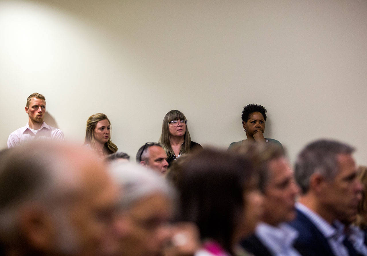 People stand along the walls of the full gallery to listen to closing arguments for the trial of William Talbott II at the Snohomish County Courthouse. (Olivia Vanni / The Herald)