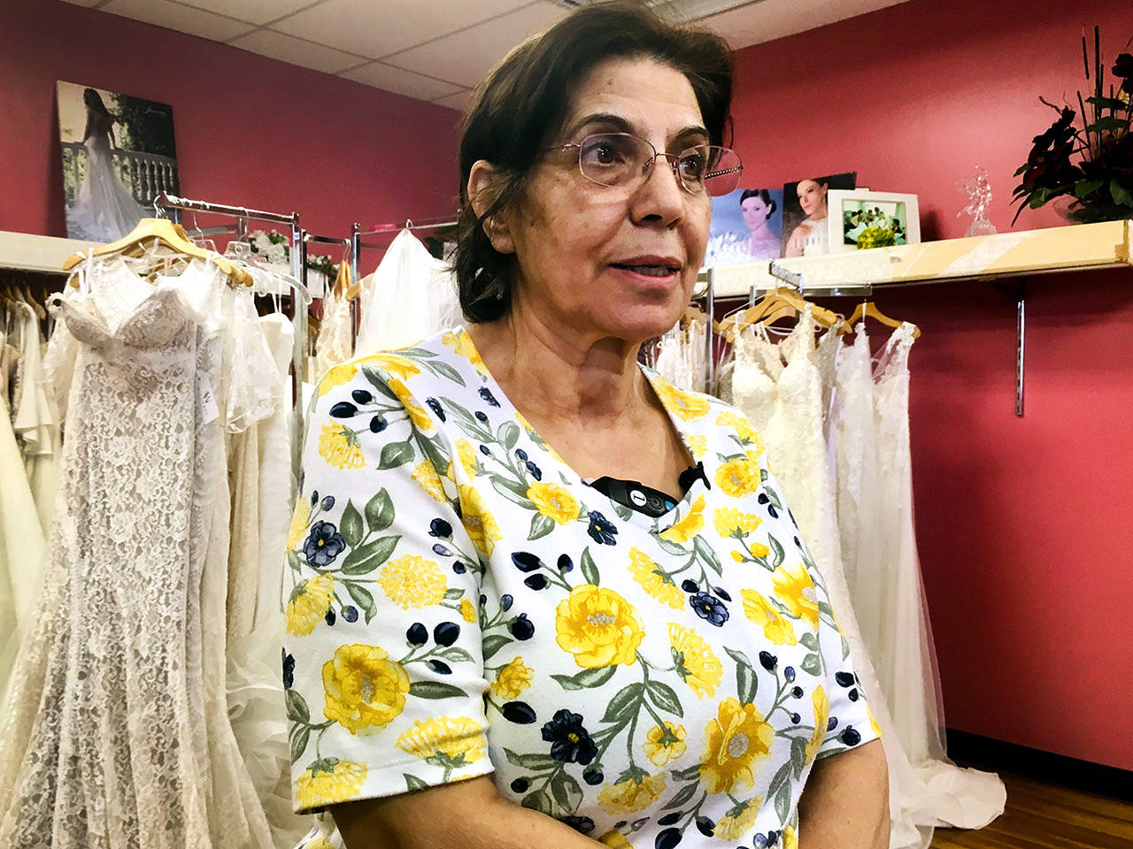 Brides and Beyond owner Mary Dlaikan on Friday talks about the theft of gowns and customer data from her shop in Lynnwood. (Sue Misao / The Herald)