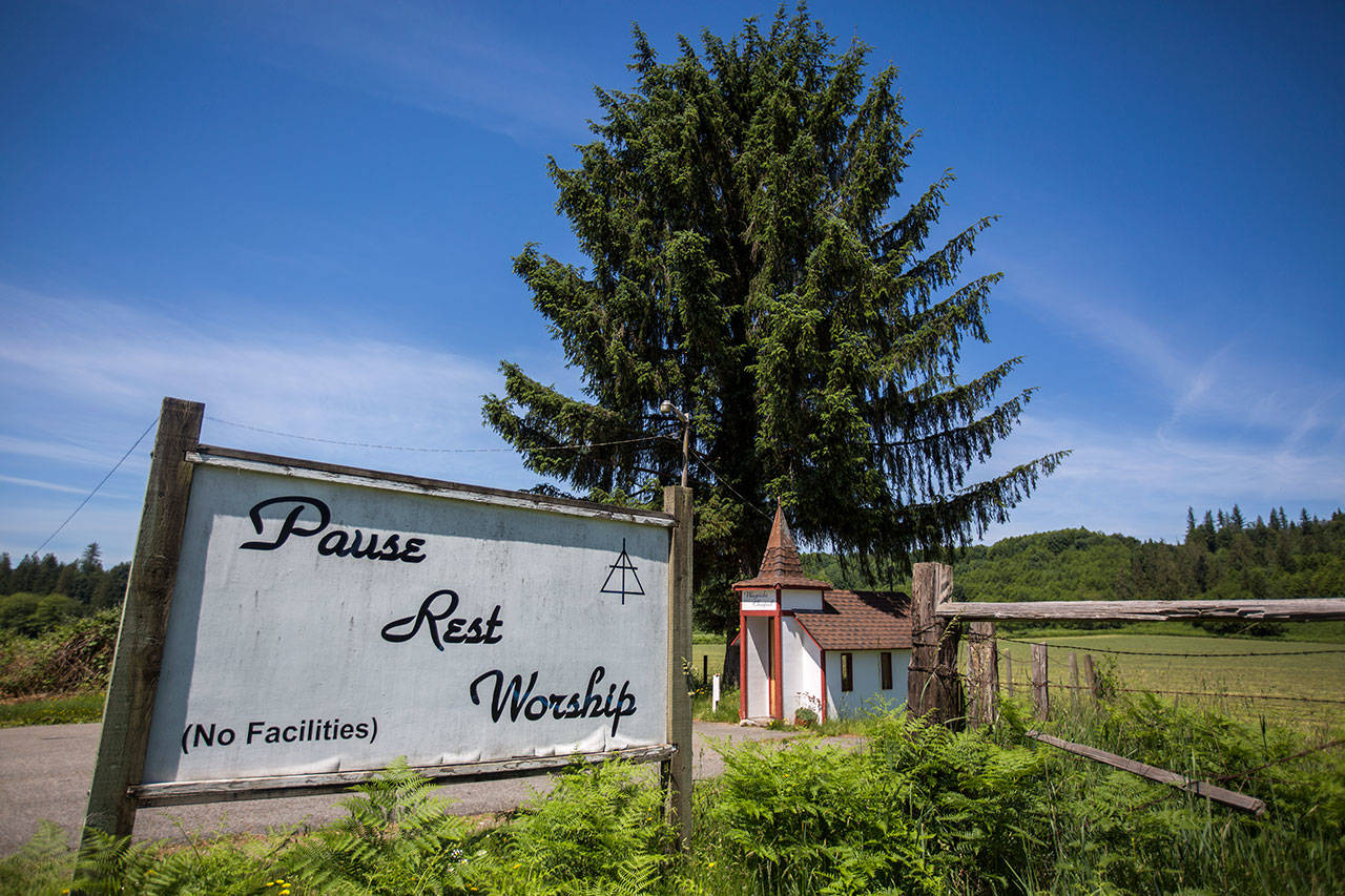 A sign reading, “Pause Rest Worship” stands outside the Wayside Chapel. (Olivia Vanni / The Herald)