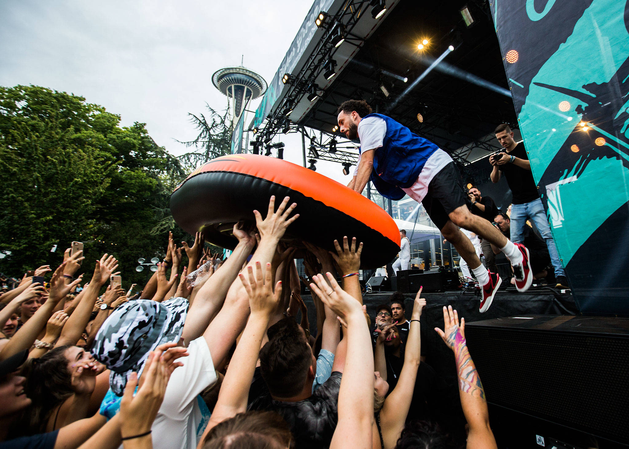 Sol jumps into an inflatable boat onto the crowd during his performance at Bumbershoot Music & Arts Festival on Friday, Aug. 30, 2019 in Seattle, Wash. (Olivia Vanni / The Herald)
