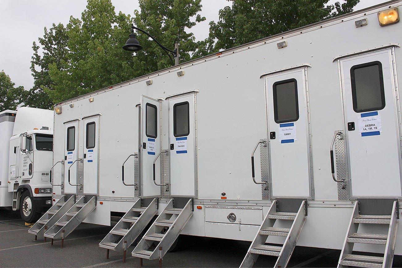 Cast trailers for “Three Busy Debras” filming at the Snoqualmie YMCA parking lot on Sept. 4. Madison Miller / staff photo