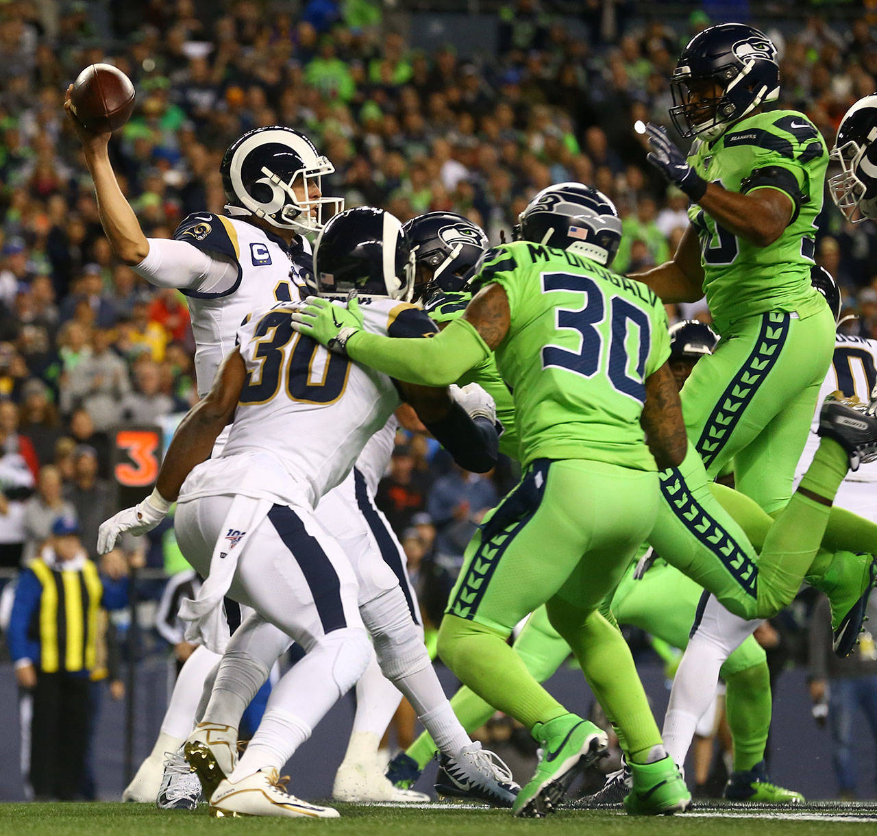Seattle defenders collapse the pocket around L.A. Rams quarterback Jared Goff during the Seahawks 30-29 win over the L.A. Rams on Thursday at CenturyLink Field in Seattle.. (Kevin Clark / The Herald)