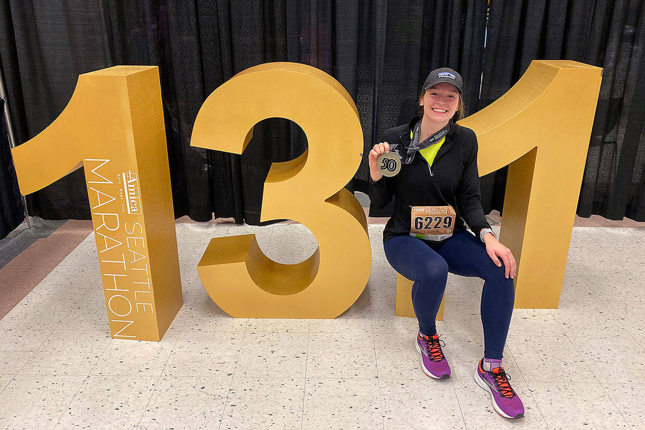 Mirror reporter Olivia Sullivan holds the Seattle Marathon 50th Anniversary medal after completing the half marathon race on Sunday, Dec. 1. Courtesy photo