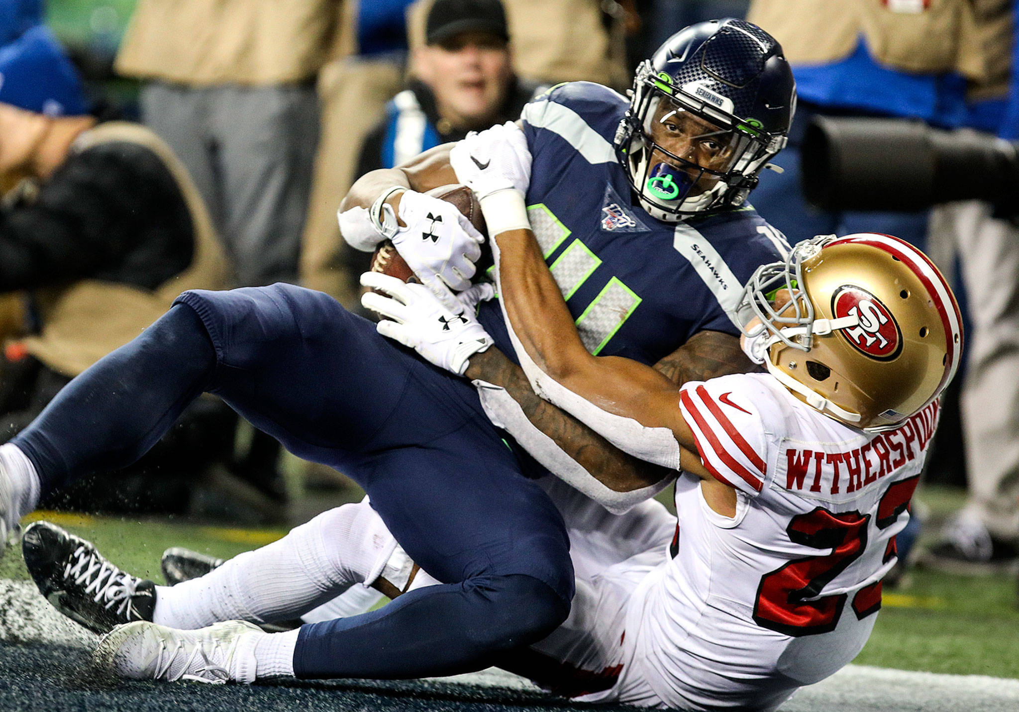 Seattle Seahawks’ DK Metcalf makes a touchdown reception with San Francisco’s Ahkello Witherspoon Sunday evening at CenturyLink Field in Seattle on December 29, 2019. The 49ers won 26-21. (TJ Mullinax / for The Herald)