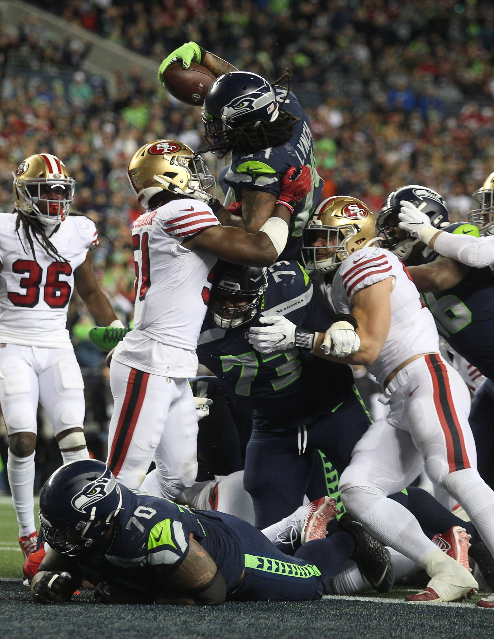 Seattle Seahawks’ Marshawn Lynch reaches up and over for a touchdown as the Seattle Seahawks lost to the San Francisco 49ers 26-21 at CenturyLink Field on Sunday, Dec. 29, 2019 in Seattle, Wash. (Andy Bronson / The Herald)