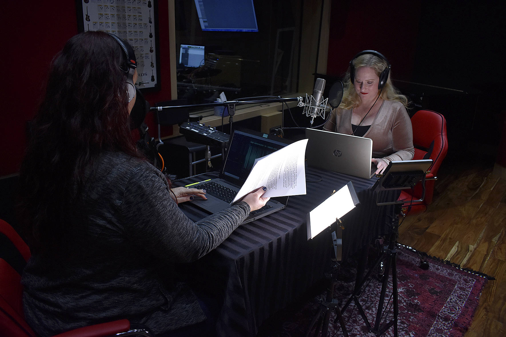 Photo by Haley Ausbun. Kim Shepard (left) and Carolyn Ossorio (right) launched a new true crime podcast, recorded at a sleek studio in Coal Creek. Ossorio is a former Renton Reporter columnist and both hosts previously worked at KIRO radio.