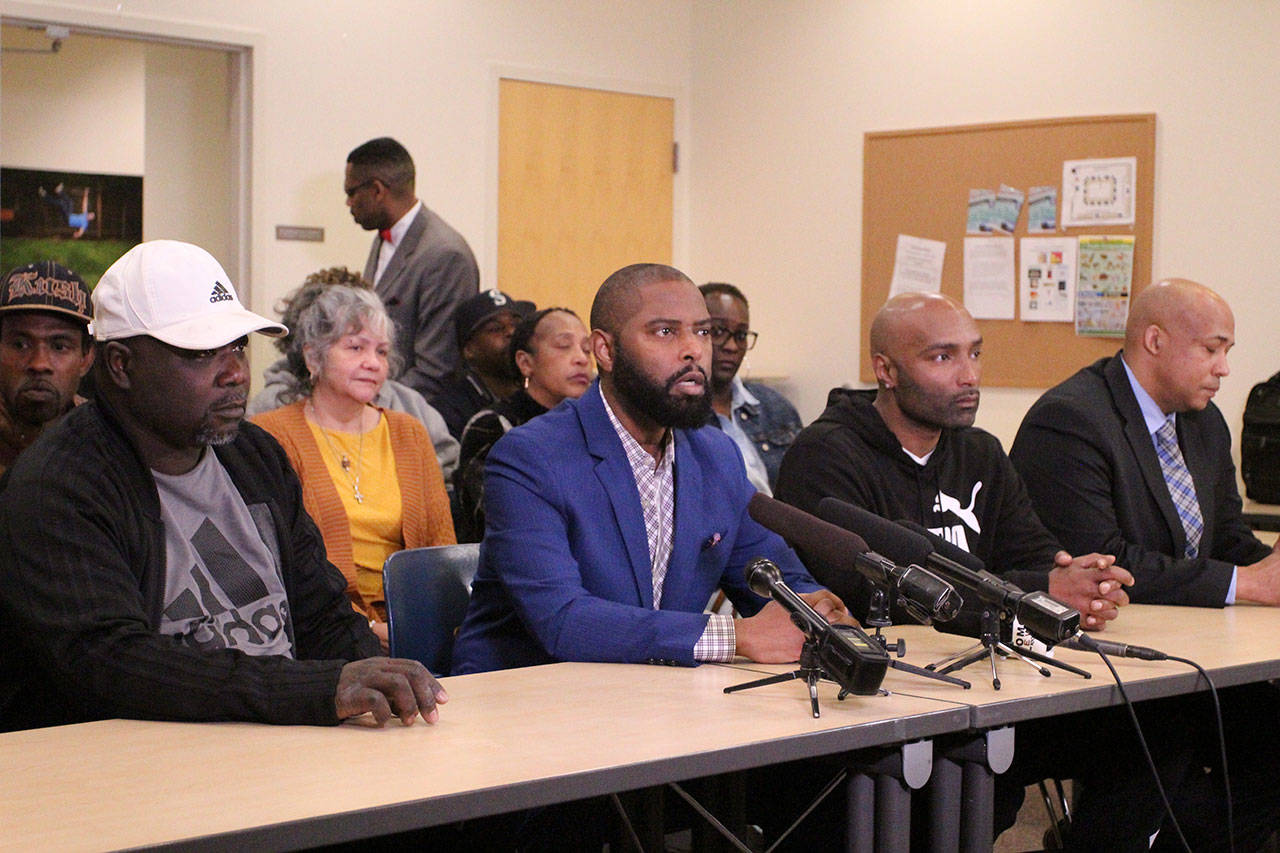 L-R: Malik’s step-father Marvin Phelps; Not This Time founder Andre Taylor; Malik’s father Marvin Donell Walker Sr.; and Attorney James Bible gather in Seattle for a press conference urging the release of video footage from Dec. 31, 2019 when Malik Williams was shot and killed by Federal Way police officers. Olivia Sullivan/staff photo
