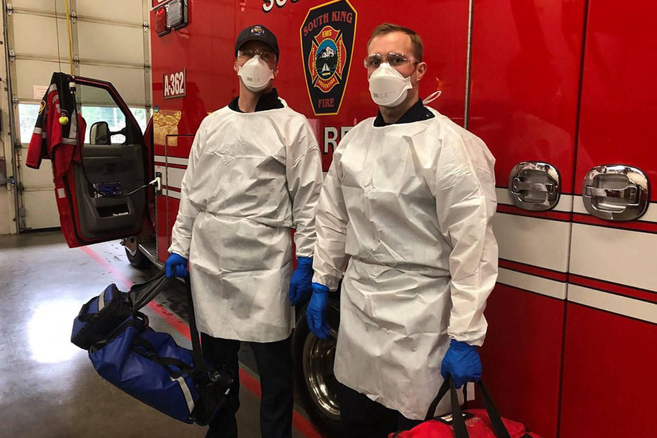 During a recent training, South King Fire and Rescue members at Station 62 wear personal protective gear, which includes face masks, eye protection, gloves and gowns. Courtesy photo