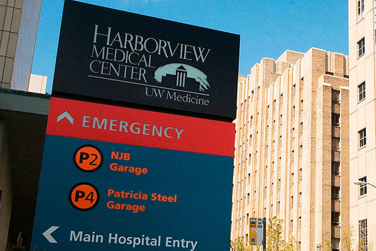 Exterior building and signage view from 9th Avenue of Harborview Medical Center in Seattle, WA.