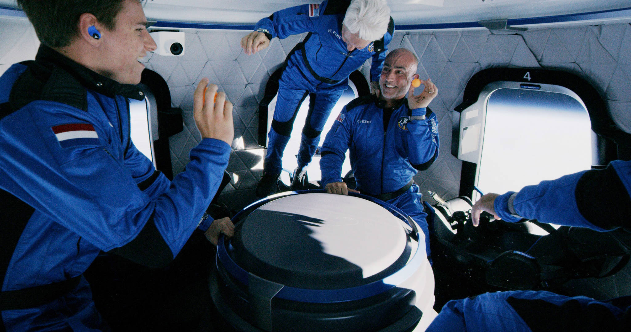 Crew members Oliver Daemen, left, Wally Funk floating and Jeff Bezos aboard New Shepard on July 20 on Blue Origin’s first human flight into space. COURTESY PHOTO, Blue Origin