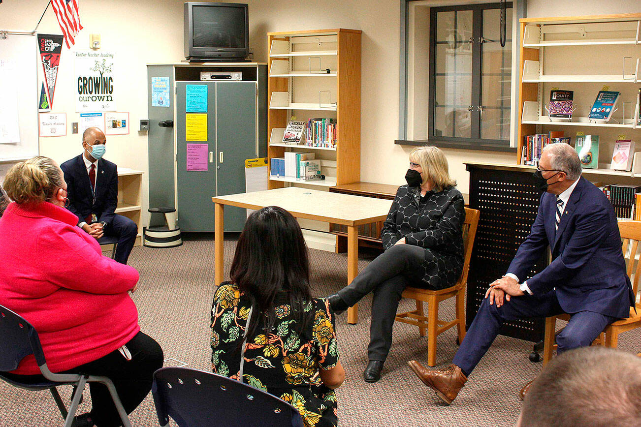 Gov. Jay Inslee and his wife, Trudi Inslee, listen to challenges faced by teachers on May 4 in Renton. (Cameron Sheppard/Sound Publishing)