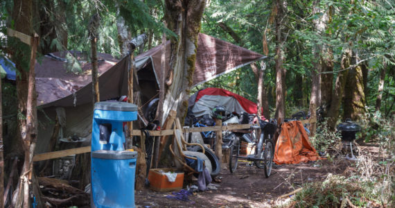 Homeless encampment in wooded area in Auburn on Friday, Aug. 27, 2021. Photo by Henry Stewart-Wood/Sound Publishing